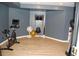 Finished basement features wood floors and an exercise area with equipment at 3145 Sweet Basil Ln, Loganville, GA 30052