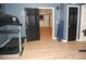 Finished basement with wood floors, exercise equipment, and easy access to other areas at 3145 Sweet Basil Ln, Loganville, GA 30052