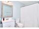 Bathroom with vanity, mirror, toilet and shower curtain at 3145 Sweet Basil Ln, Loganville, GA 30052