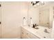 Bathroom features double sinks, a large mirror, and a modern lighting fixture at 3145 Sweet Basil Ln, Loganville, GA 30052