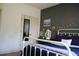 Bedroom featuring a white metal bed frame and dark accent wall at 3145 Sweet Basil Ln, Loganville, GA 30052