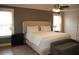 Cozy bedroom with neutral walls, plush king bed with upholstered headboard, and plenty of natural light at 3145 Sweet Basil Ln, Loganville, GA 30052