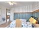 Bedroom features decorative walls, hardwood floors, a ceiling fan, and an open doorway at 3145 Sweet Basil Ln, Loganville, GA 30052
