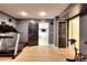 Home gym with treadmill and view to an adjacent room at 3145 Sweet Basil Ln, Loganville, GA 30052