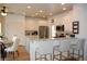 Well-lit kitchen with stainless steel appliances, granite counters, and an adjacent breakfast area at 3145 Sweet Basil Ln, Loganville, GA 30052