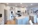 Modern kitchen with white cabinets, granite countertops, stainless steel appliances, and central island for cooking and entertaining at 3145 Sweet Basil Ln, Loganville, GA 30052