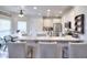 White kitchen features granite countertops and an island with barstool seating at 3145 Sweet Basil Ln, Loganville, GA 30052