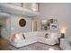 Bright living room with large sectional sofa and gallery wall at 3145 Sweet Basil Ln, Loganville, GA 30052