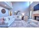 Bright, open living room with fireplace, comfortable seating, and large windows at 3145 Sweet Basil Ln, Loganville, GA 30052