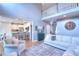 Open-concept living room with high ceilings, stylish furniture, and a glimpse of the kitchen at 3145 Sweet Basil Ln, Loganville, GA 30052