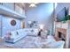 Bright living room with fireplace, lots of seating, and large windows for natural light at 3145 Sweet Basil Ln, Loganville, GA 30052