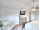 Serene main bedroom with a tray ceiling, ceiling fan, and hardwood floors, perfect for unwinding after a long day at 3145 Sweet Basil Ln, Loganville, GA 30052