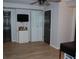 Home office features hardwood floors, storage cabinet, and a wall-mounted TV at 3145 Sweet Basil Ln, Loganville, GA 30052