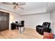 Office space with wood laminate floors, desk setup, and comfortable recliner chair at 3145 Sweet Basil Ln, Loganville, GA 30052