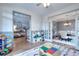 Playroom with hardwood floors and great view into the foyer and dining room that's great for entertaining guests at 3145 Sweet Basil Ln, Loganville, GA 30052