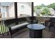 Covered patio with cushioned seating and a fire pit, perfect for outdoor enjoyment at 3145 Sweet Basil Ln, Loganville, GA 30052