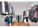 Spacious walk-in closet with custom shelving and hardwood floors, perfect for organizing your wardrobe with ease at 3145 Sweet Basil Ln, Loganville, GA 30052