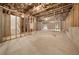 Unfinished basement with exposed wooden beams, concrete foundation, and visible ductwork at 382 Tillman Pass, Woodstock, GA 30188