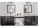 Elegant bathroom featuring dual sinks and stylish black cabinetry at 382 Tillman Pass, Woodstock, GA 30188