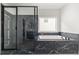 Bathroom showcases sleek shower and tub with black marble accents at 382 Tillman Pass, Woodstock, GA 30188