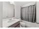 Cozy bathroom with combined shower and tub and a large sink at 382 Tillman Pass, Woodstock, GA 30188