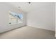 Bright bedroom features a large window and neutral carpet at 382 Tillman Pass, Woodstock, GA 30188
