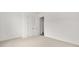 Carpeted bedroom with a double closet featuring white trim at 382 Tillman Pass, Woodstock, GA 30188