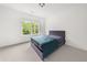 Relaxing bedroom with a large window and a stylish bed at 382 Tillman Pass, Woodstock, GA 30188