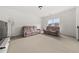 Spacious living room with plush seating and a large window at 382 Tillman Pass, Woodstock, GA 30188