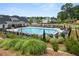 Community pool with many lounge chairs and seating areas for residents at 382 Tillman Pass, Woodstock, GA 30188