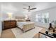 Serene bedroom with neutral tones, comfortable bed, and large window providing ample light at 4248 River Green Dr # 305, Atlanta, GA 30327