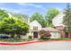 Charming clubhouse featuring large windows, professional landscaping, and brick-paved walkway, providing a welcoming entrance at 4248 River Green Dr # 305, Atlanta, GA 30327