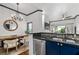 Stylish dining area with a rustic wooden table and chairs, open to the modern kitchen at 4248 River Green Dr # 305, Atlanta, GA 30327