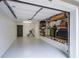 Well lit garage with coated flooring and built-in shelving on the sidewall at 4248 River Green Dr # 305, Atlanta, GA 30327