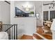 Modern kitchen with dark blue cabinets and stainless steel appliances open to a dining area with seating at 4248 River Green Dr # 305, Atlanta, GA 30327