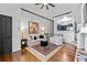 Cozy living room features hardwood floors, comfortable seating, and an open view into the kitchen area at 4248 River Green Dr # 305, Atlanta, GA 30327