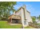 The home's backyard features a walkout basement and a spacious wooden deck at 5821 Saint Miles Drive Dr, Buford, GA 30518