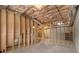 Unfinished basement with exposed ceiling, concrete floors, and framed walls at 5821 Saint Miles Drive Dr, Buford, GA 30518