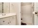Bathroom featuring vanity with drawers, a toilet, and a tub with shower at 5821 Saint Miles Drive Dr, Buford, GA 30518
