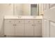 Bathroom vanity with double sinks, plenty of storage, and large mirror at 5821 Saint Miles Drive Dr, Buford, GA 30518
