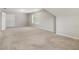 Spacious carpeted bedroom featuring natural light from a large window at 5821 Saint Miles Drive Dr, Buford, GA 30518