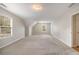Large carpeted bedroom with two windows offering ample natural light at 5821 Saint Miles Drive Dr, Buford, GA 30518