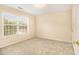 Bedroom with carpet flooring and a large window at 5821 Saint Miles Drive Dr, Buford, GA 30518