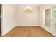 Dining room with hardwood floors and bright window, ready for entertaining at 5821 Saint Miles Drive Dr, Buford, GA 30518