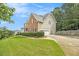 Charming two-story home with a brick and siding exterior, well-manicured lawn, and mature landscaping at 5821 Saint Miles Drive Dr, Buford, GA 30518