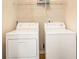 Laundry room featuring a side-by-side washer and dryer and shelving at 5821 Saint Miles Drive Dr, Buford, GA 30518