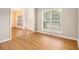 Bright living room with hardwood floors and large windows, perfect for relaxing at 5821 Saint Miles Drive Dr, Buford, GA 30518