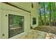 Home exterior with a concrete patio and sliding glass doors to the backyard at 1925 Sailcloth St, Lithonia, GA 30058
