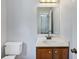 Bathroom vanity featuring a sink, wood cabinet, and mirror at 1925 Sailcloth St, Lithonia, GA 30058