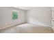 Spacious bedroom featuring a window with view to backyard at 1925 Sailcloth St, Lithonia, GA 30058